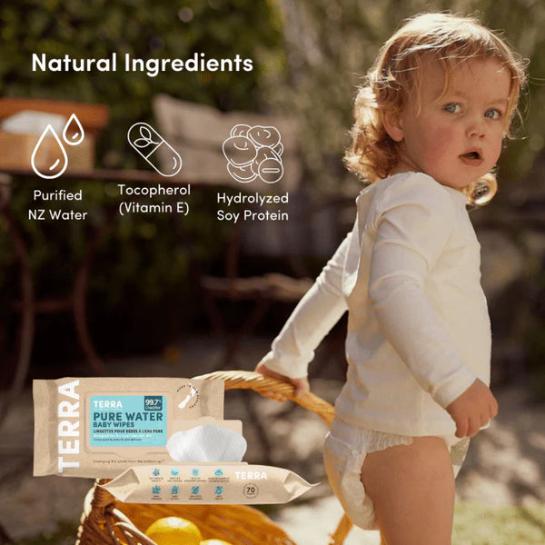 Child holding a package of Terra Pure Water Wipes with natural ingredients listed above.