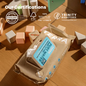 Terra wipes packaging with certifications on a wooden surface