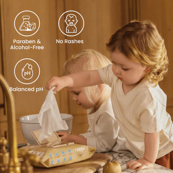 Two children playing with a package of Terra baby wipes, with product benefits displayed.
