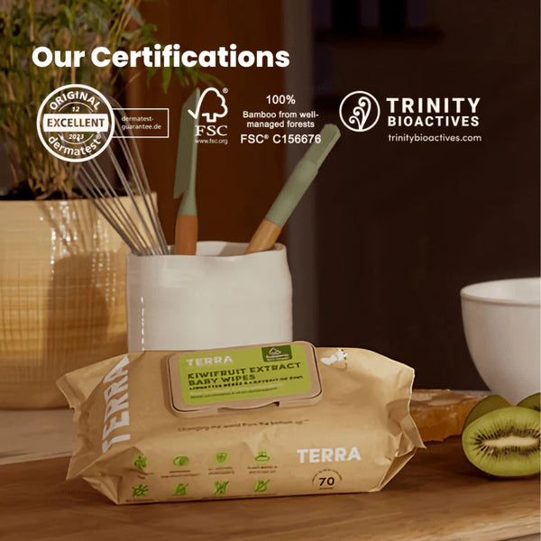 Terra baby wipes packaging with certifications displayed on a blurred background